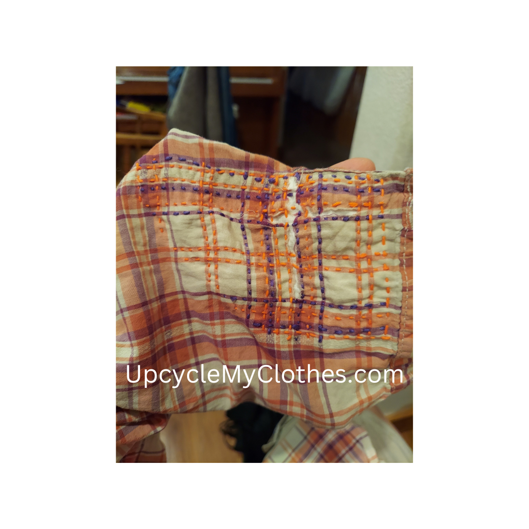 Outside of mended plaid elbow